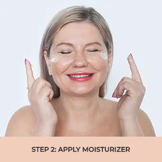 woman applying moisturizer