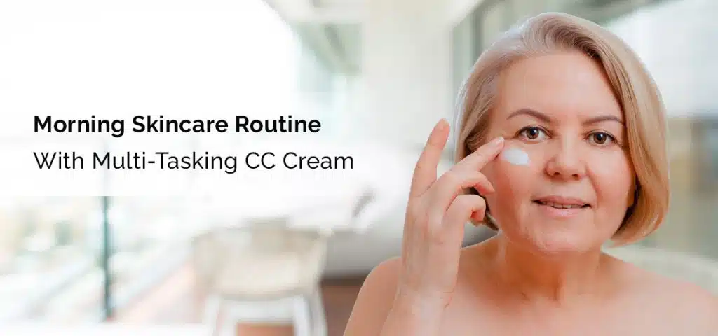 woman applying cream on face