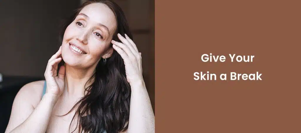 Smiling woman touching face promoting skincare break