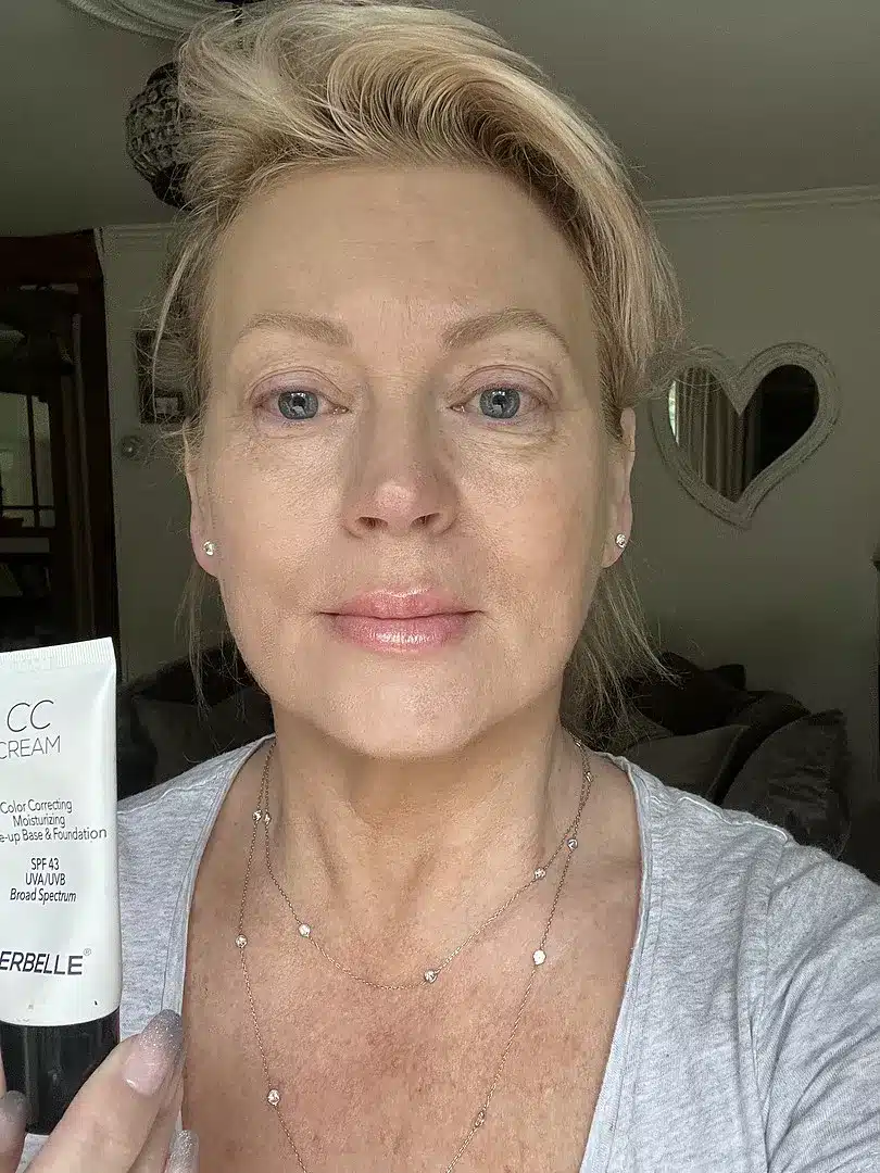 Woman holding Perbelle CC Cream tube